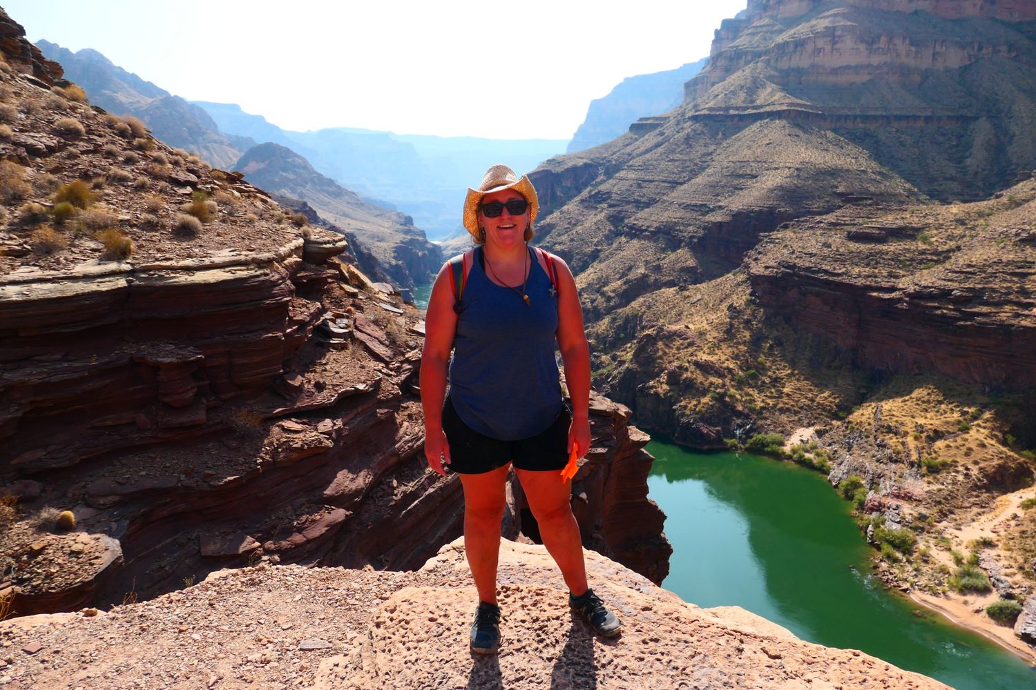 Heidi Miller on a ledge above the Colorado River